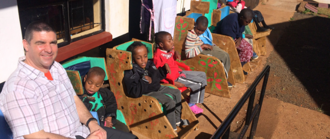 children in chairs in kenya