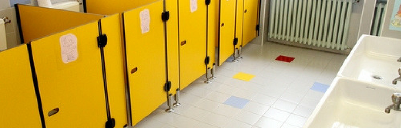 school toilet cubicles with yellow doors