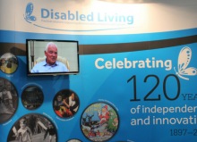 disabled living 120 years stand with tv screen at kidz to adultz north