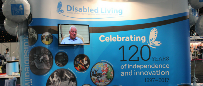 disabled living 120 years stand with tv screen at kidz to adultz north