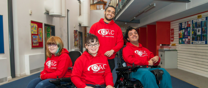 children and young people in qac hoodies
