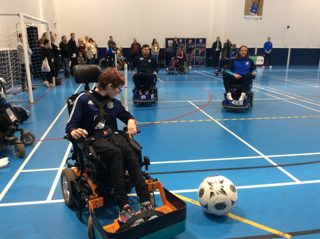 QAC Powerchair football student