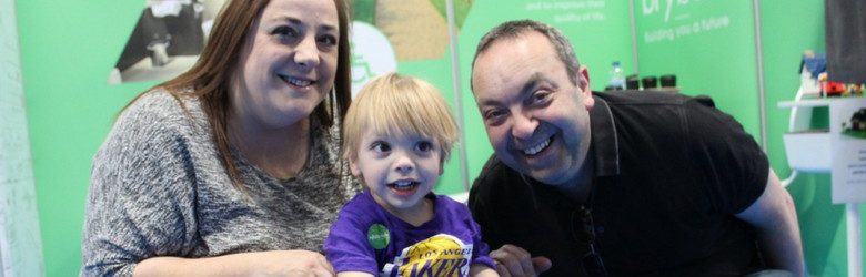 aiden with his mum and dad at kidz to adultz exhibition