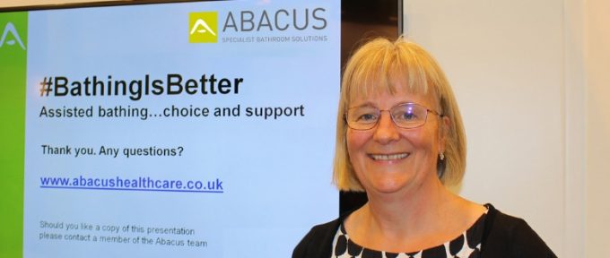 kate sheehan next to screen with seminar title