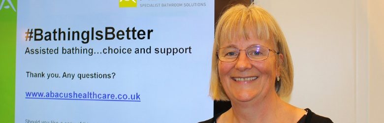 kate sheehan next to screen with seminar title