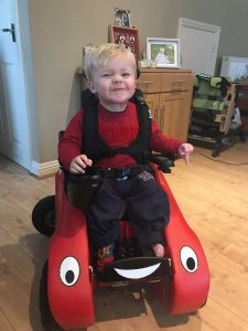 oscar smiling in his wizzybug