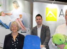 three abacus representatives stood at their exhibition stand