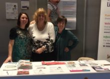 together for short lives representatives stood at their exhibition stand