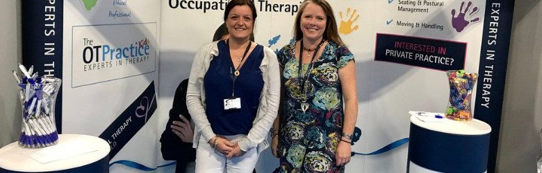 two members of the ot practice stood at their stand