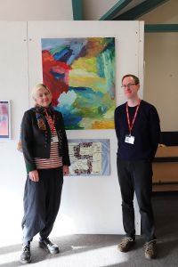 liz and jim stood next to artwork