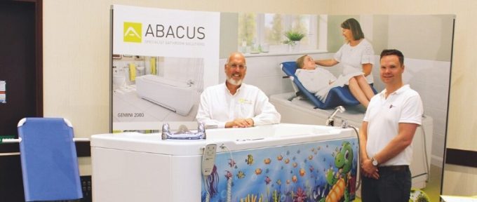 adam and colleague stood at their exhibtion stand