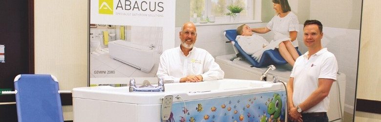adam and colleague stood at their exhibtion stand