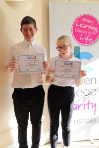 james and isabel holding their certificates