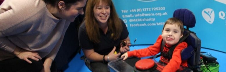 child smiling using equipment at event