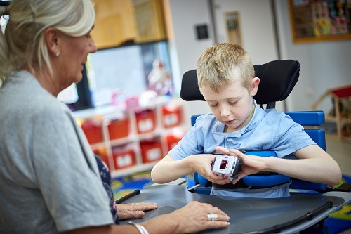 young boy in supine stander