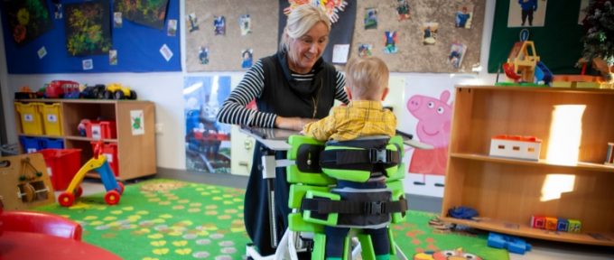 lady with young boy in multistander