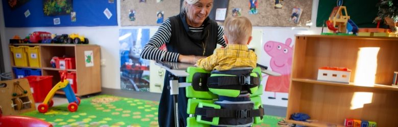 lady with young boy in multistander