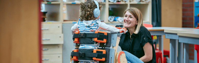 woman smiling and child using Jenx equipment