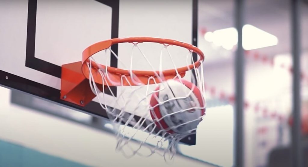 Basketball falling through hoop