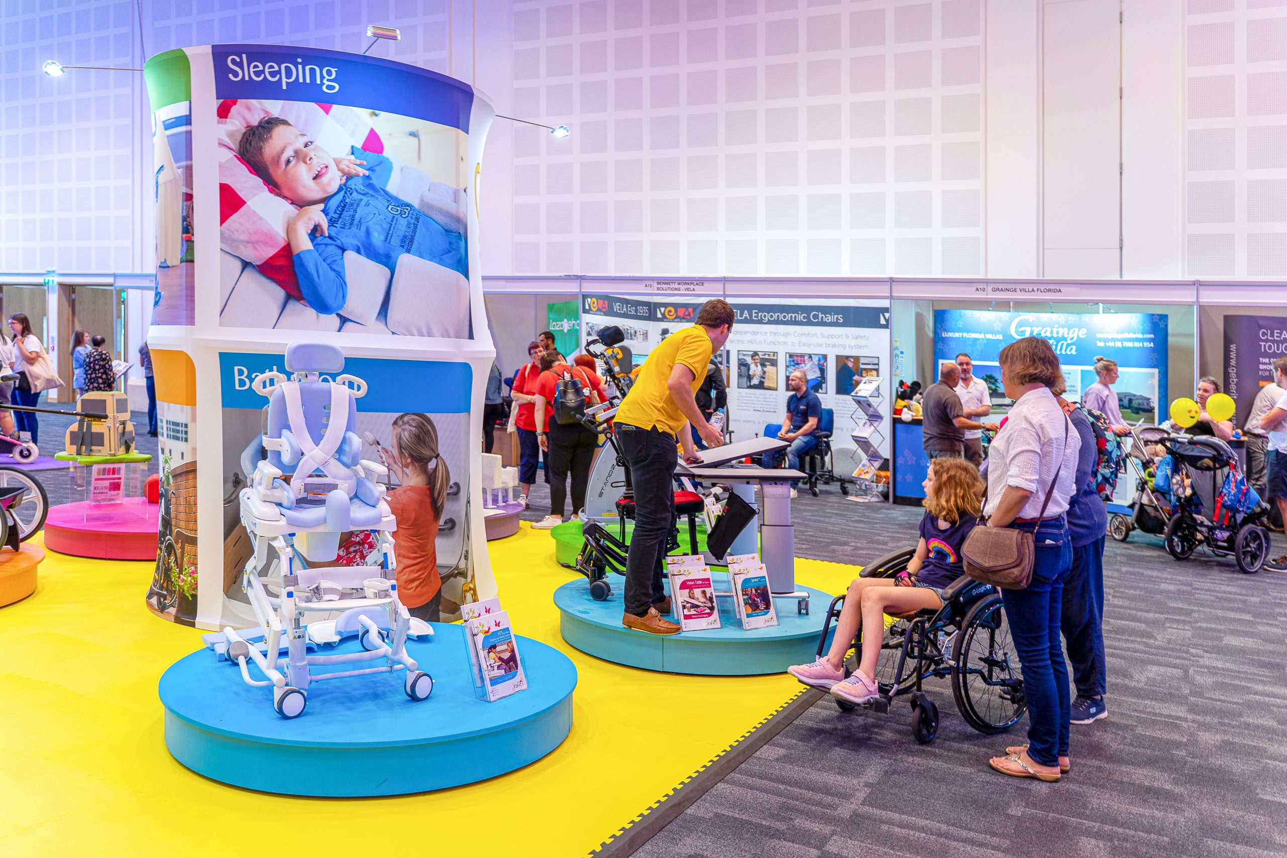 Busy exhibition space with attendees looking at stand